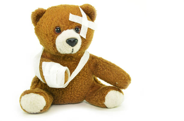 istock Injured teddy bear with bandages 1011250272