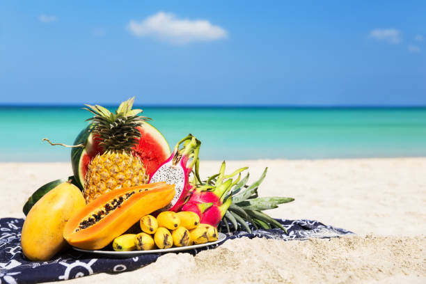 Fresh different tropical fruits placed on the plate