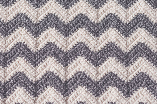 Gray and white ripple striped crochet stitch background