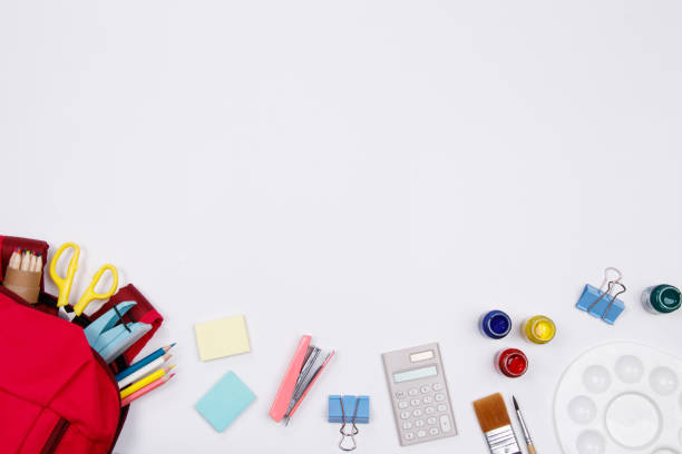 istock Stationeries and office supplies on white background. Flat lay. Top view with copy space. Back to school concept. 1011263670