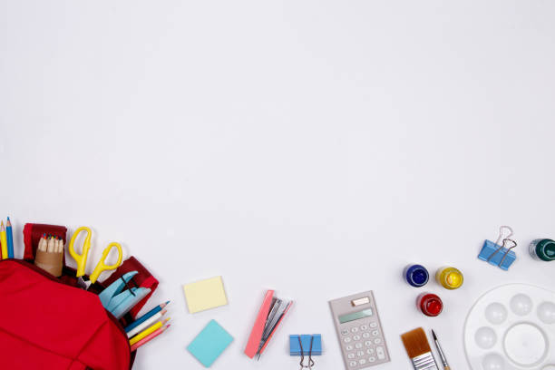 istock Stationeries and office supplies on white background. Flat lay. Top view with copy space. Back to school concept. 1011264064