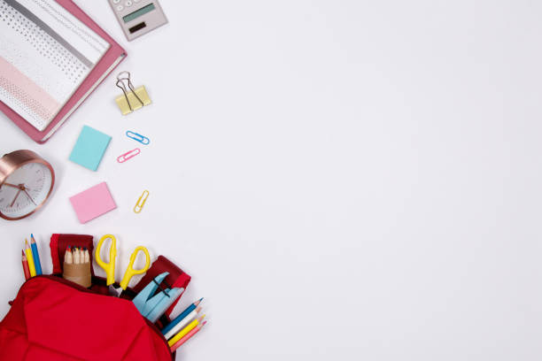 istock Stationeries and office supplies on white background. Flat lay. Top view with copy space. Back to school concept. 1011264068