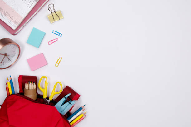 istock Stationeries and office supplies on white background. Flat lay. Top view with copy space. Back to school concept. 1011264070