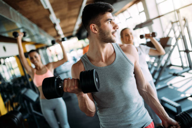 istock Determined male working out in gym 1011267084