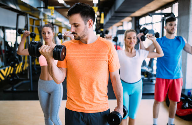 istock Group of people training in gym 1011270540
