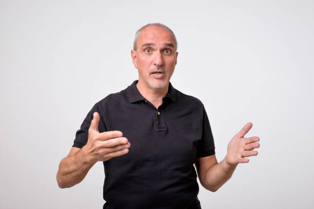 Argue with gestures. Mature hispanic man is trying to explaine his rightness.