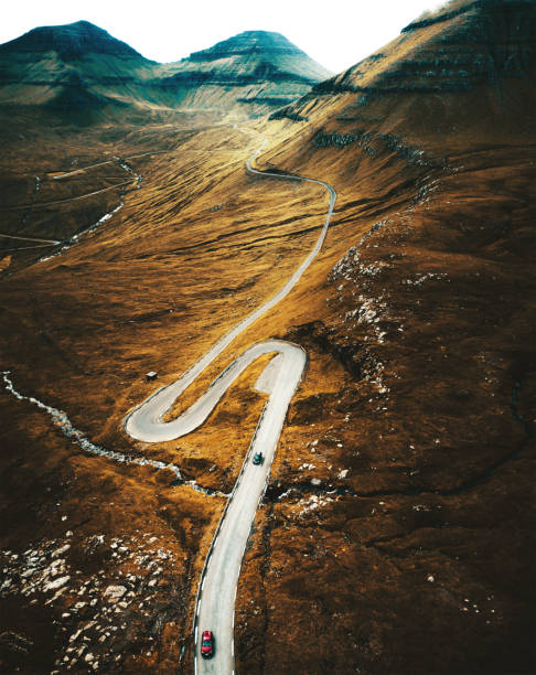 istock winding road at the faroe islands 1011277120