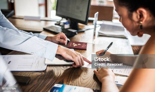 Guests Checking In To A Hotel Stock Photo - Download Image Now - Passport, UK, Brochure