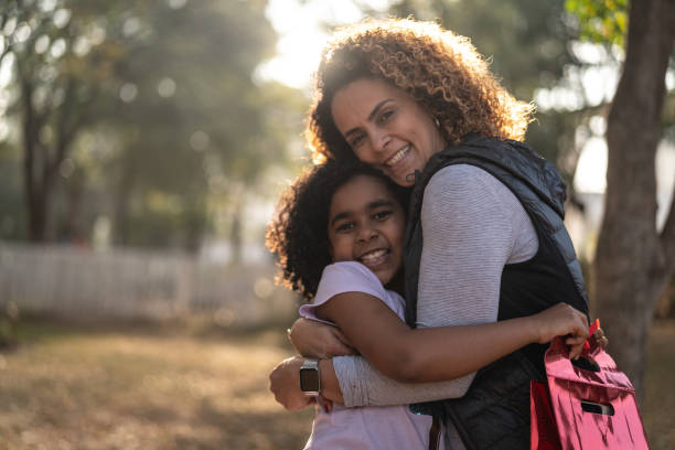 istock Mother Giving a Gift for your Her Daughter 1011279722