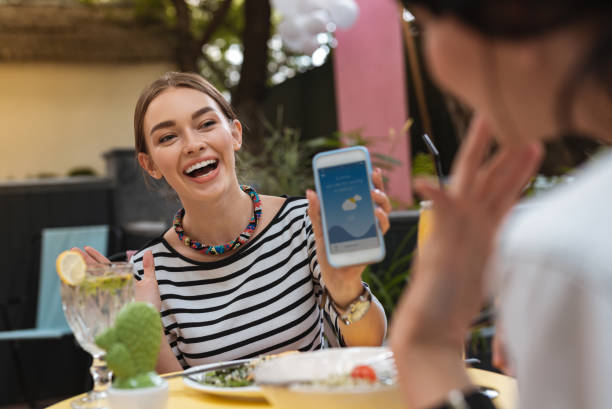 istock Businesswoman feeling nice after seeing warm summer weather forecast 1011280010