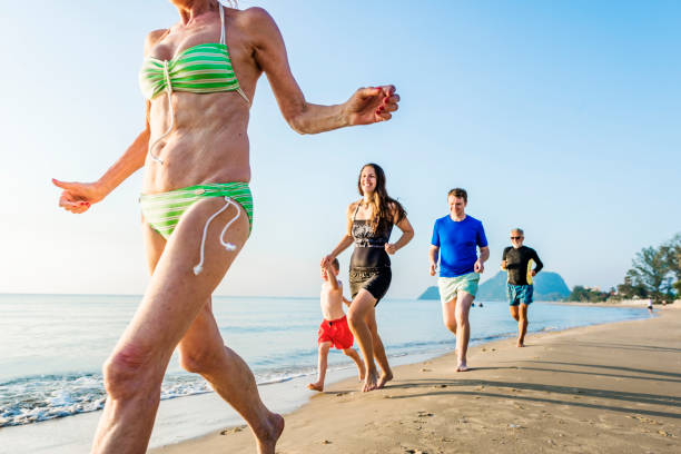 istock Family playing at the beach 1011280096