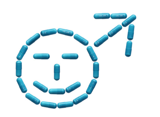 istock Tablets are lined in a male smiling symbols. Increased potency and erection. Human health. Medicine of sexual relations. Orgasm and ejaculation. Estrodiol for sexual activity. Isolate on white 1011280926