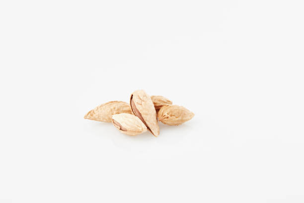almonds with rind on white fund