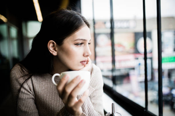 istock women who is enjoy in cafe 1011283234