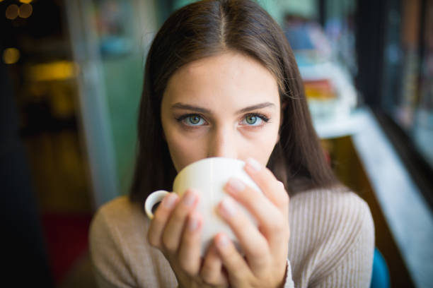 istock women who is enjoy in cafe 1011283282