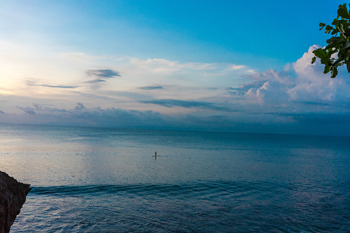 one person on full frame ocean view with blue sky and white clouds