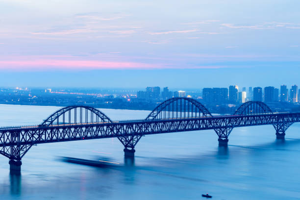 istock jiujiang yangtze river bridge in nightfall 1011287906