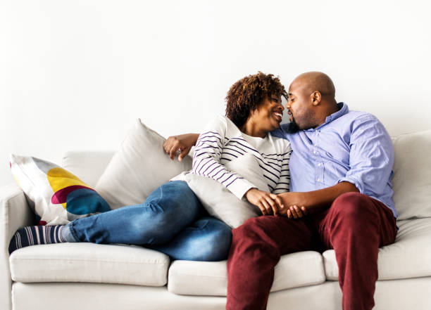 istock Happy couple relaxing at home 1011297052
