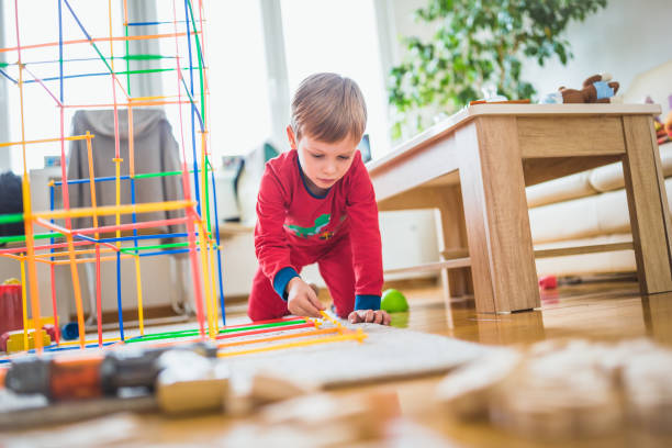 istock Cute boy playing at home. 1011298160