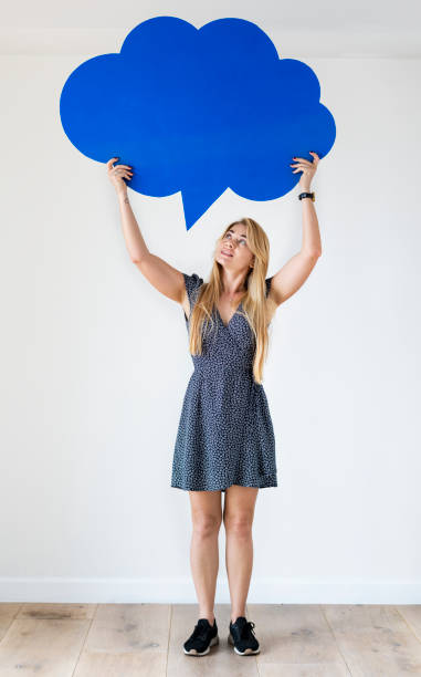 istock Happy Caucasian woman holding copyspace speech bubble 1011303660