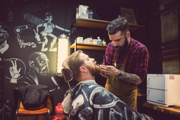 istock Ginger, bearded guy at the barber shop 1011306396