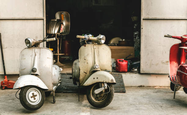 istock Old scooter parked on a street 1011306456