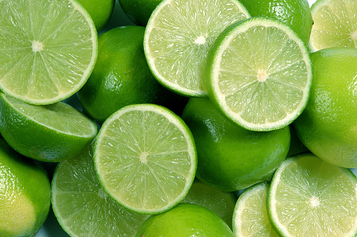Three limes on white background