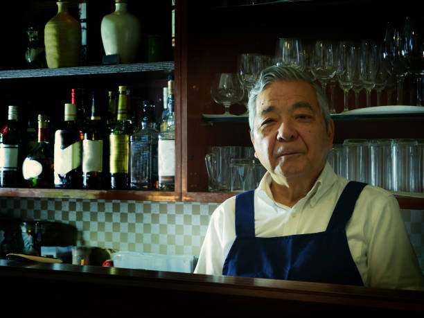 istock Older male bartender hospitality 1011313716
