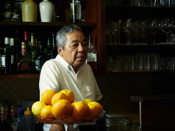 istock Older male bartender hospitality 1011313728