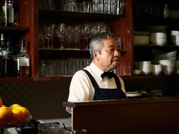 istock Older male bartender hospitality 1011313732