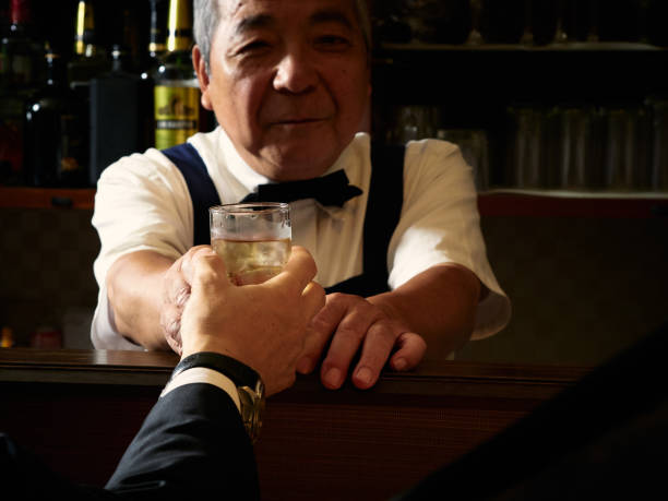 istock Older male bartender hospitality 1011313734