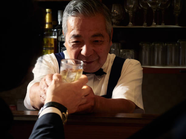 istock Older male bartender hospitality 1011313738