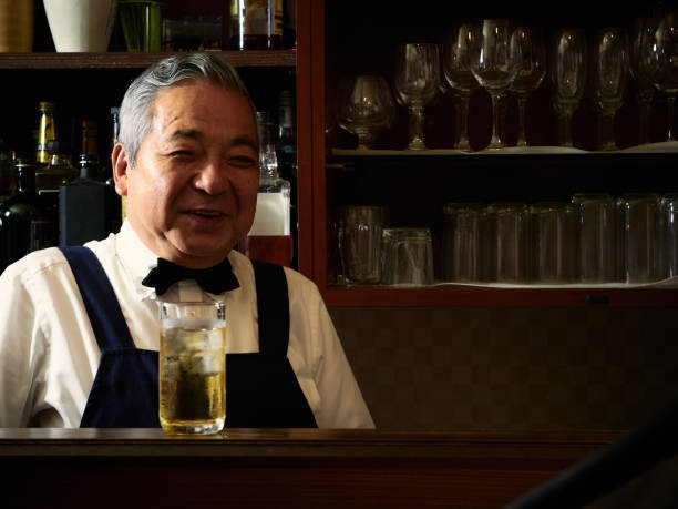 istock Older male bartender hospitality 1011313744