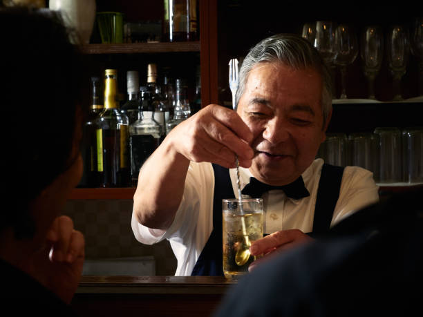 istock Older male bartender hospitality 1011313752