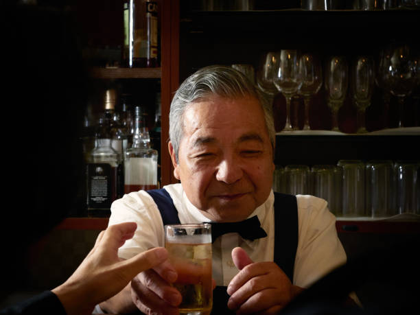istock Older male bartender hospitality 1011313758