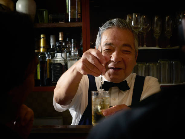 istock Older male bartender hospitality 1011313762