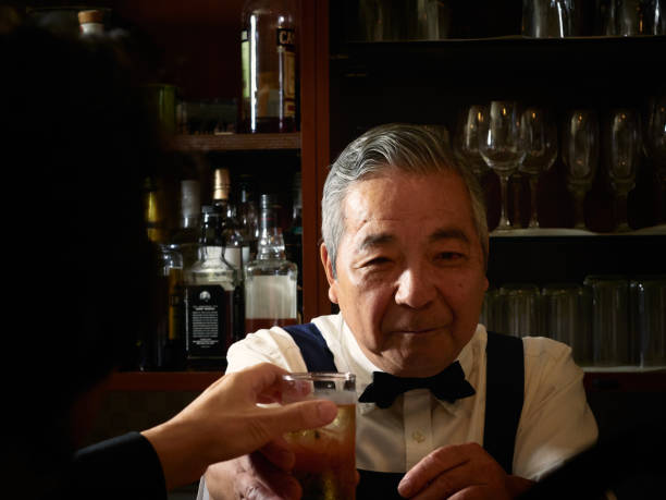 istock Older male bartender hospitality 1011313772
