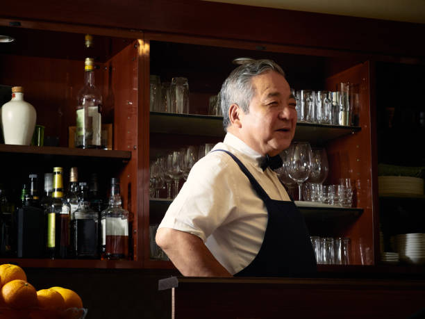istock Older male bartender hospitality 1011313782