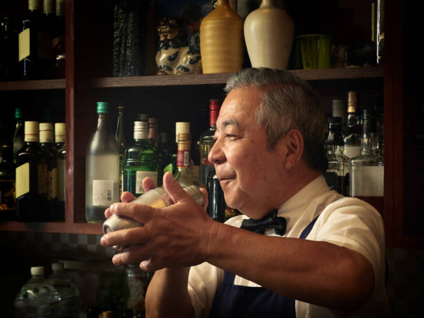 istock Older male bartender hospitality 1011313804