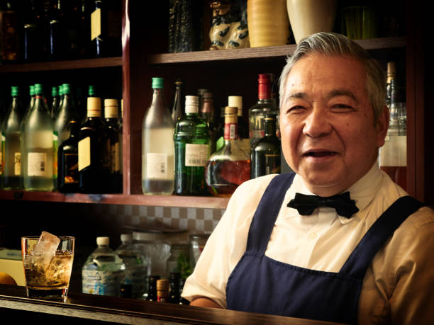 Older male bartender hospitality