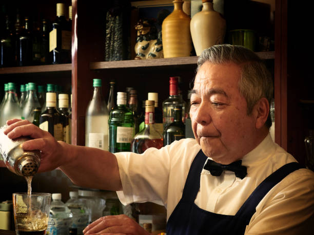 istock Older male bartender hospitality 1011313822