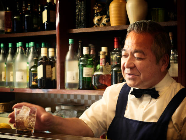 istock Older male bartender hospitality 1011313826