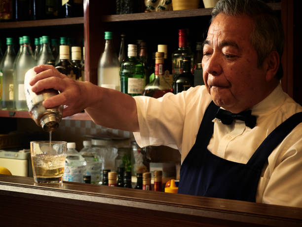 istock Older male bartender hospitality 1011313828