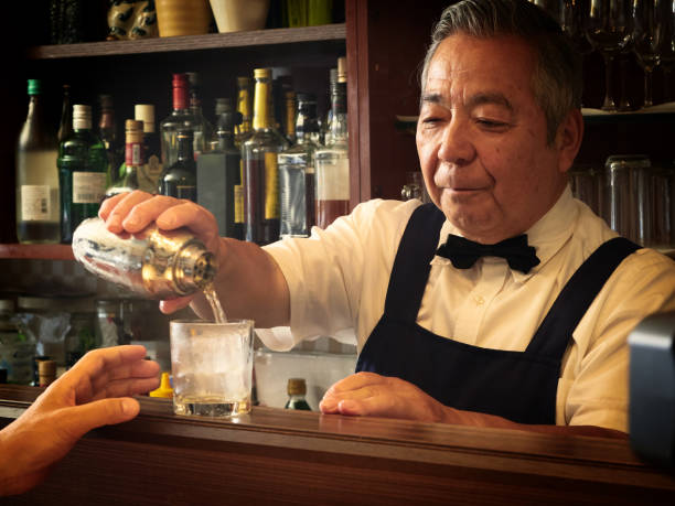 istock Older male bartender hospitality 1011313830