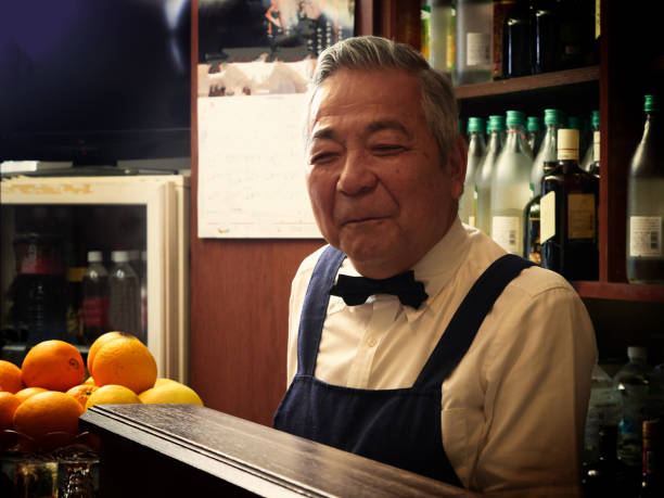 istock Older male bartender hospitality 1011313852
