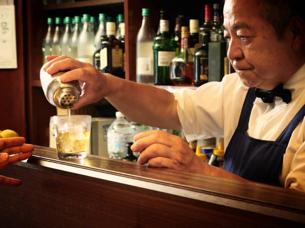 istock Older male bartender hospitality 1011313854