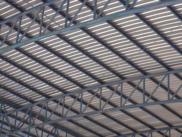 istock Big warehouse steel plate roof. 1011313954