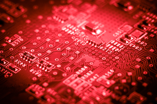 computer electronic microcircuits. macro. red close-up technology