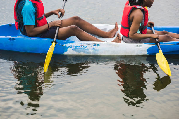 istock Couple canoeing in a lake 1011316408