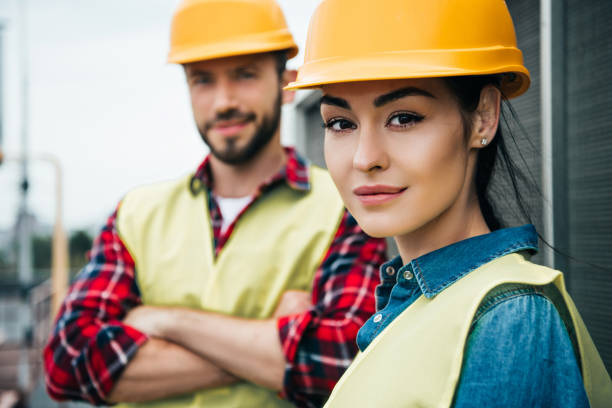 istock selective focus of professional engineers in helmets 1011317214